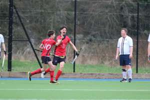 Mens team high-fiving a goal